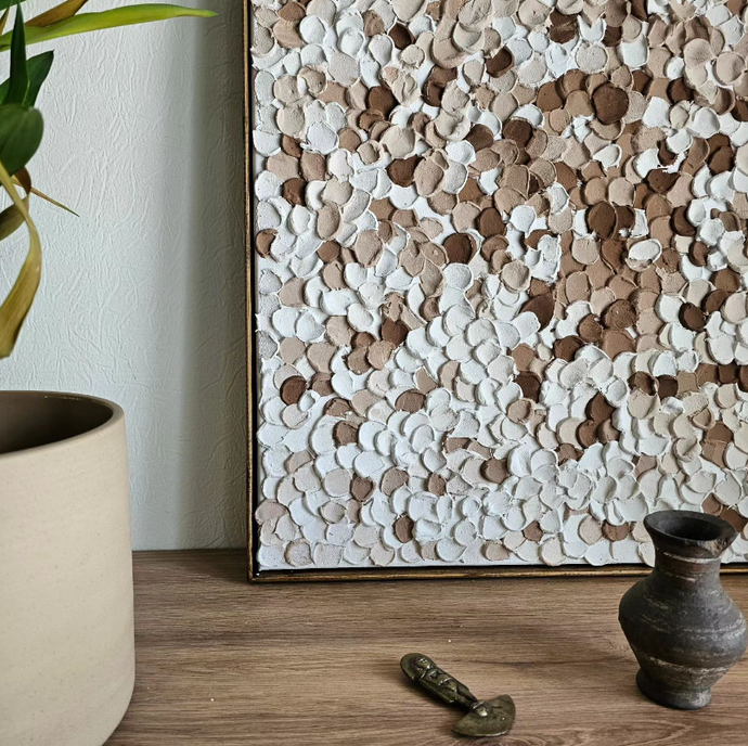 multicolored coarse textured painting on a table